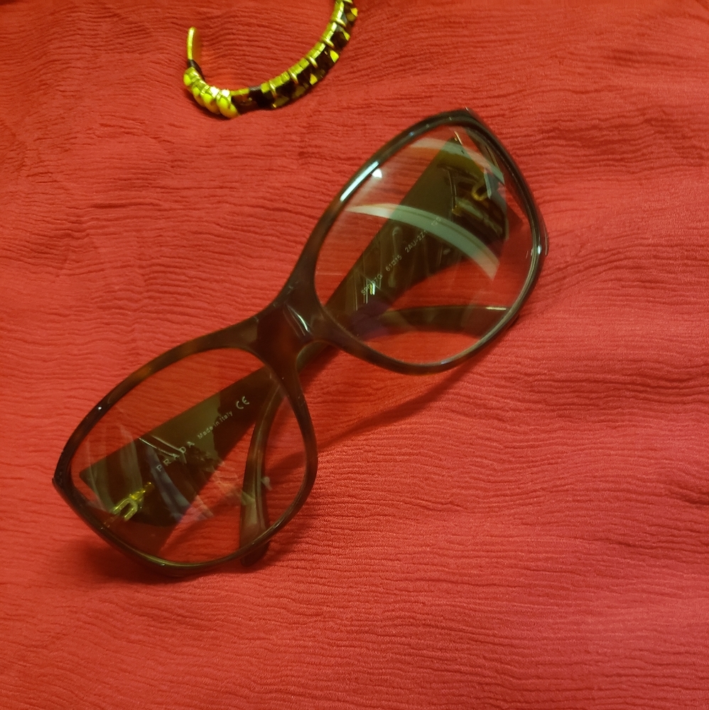 Desirable Prada in tortoise frame and amber shade!